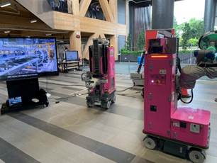 A pink machine in a room

Description automatically generated