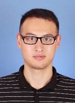 A person wearing glasses and looking at the camera

Description automatically generated